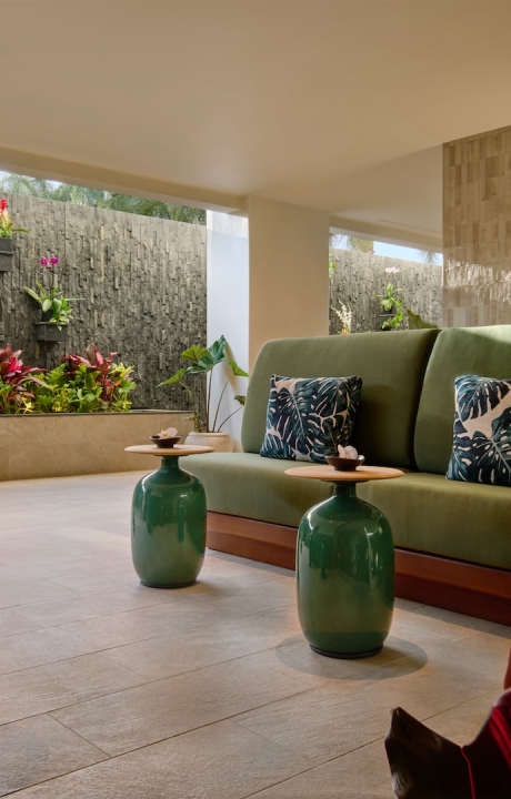 Hydrothermal Gardens Lounge featuring a vibrant green wall, creating a refreshing and inviting atmosphere for guests.