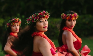 Luau dancers posing at dusk