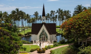 A chapel nested in a green garden